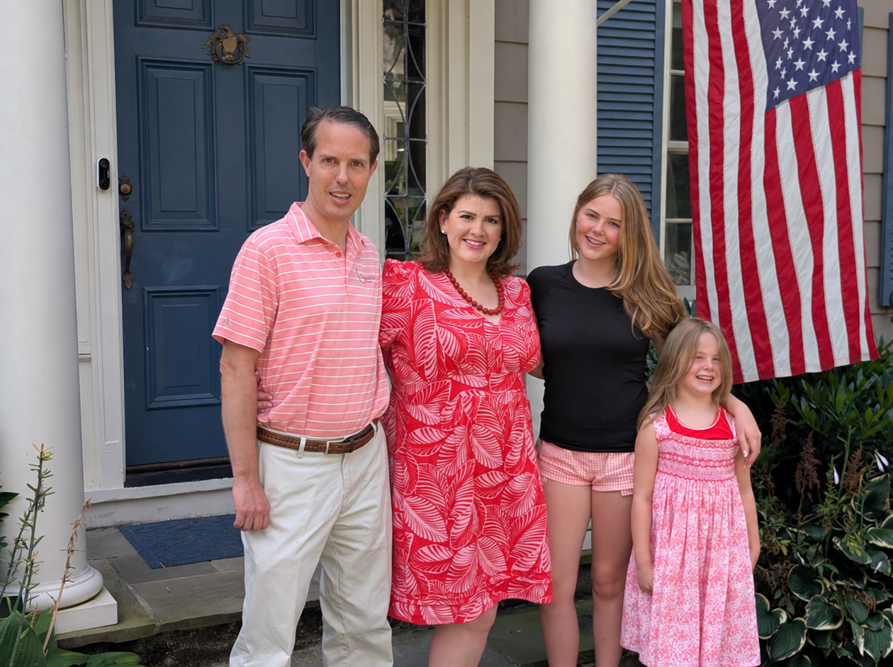 Emily Hau with her husband and two daughters outside their Fairfield home